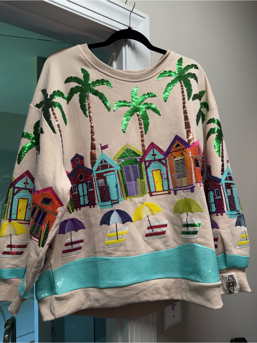 QUEEN OF SPARKLES Cream Sequin Palm & Beach Hut Sweatshirt with Aqua Hem
